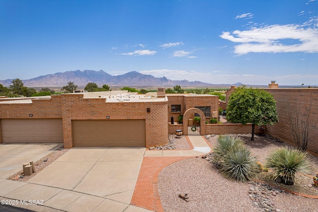 781 W Desert Ridge Dr, Green Valley, AZ 85622 - view of front of property with a mountain view, brick siding, and driveway
