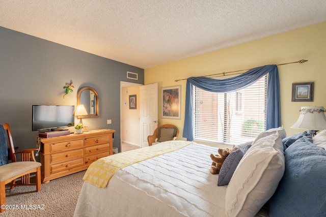 781 W Desert Ridge Dr, Green Valley, AZ 85622 - carpeted bedroom with a textured ceiling
