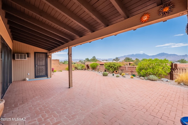 781 W Desert Ridge Dr, Green Valley, AZ 85622 - fenced backyard featuring a mountain view, a patio area, and an AC wall unit