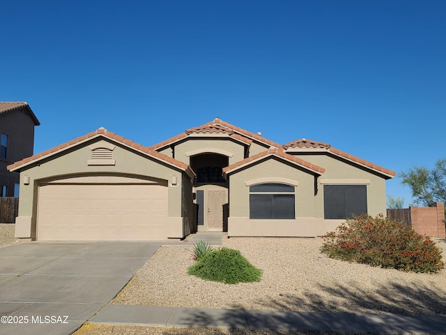 17144 S Scarlet Cliff Pl, Vail, AZ 85641 - mediterranean / spanish house featuring stucco siding, a garage, driveway, and a tile roof