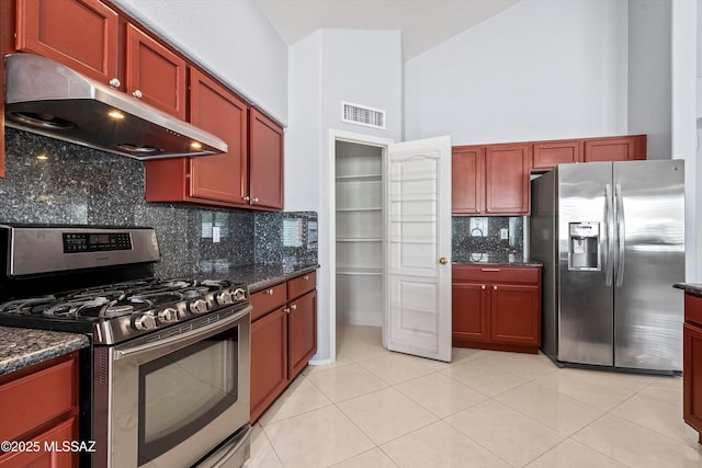 9422 N Weather Hill Dr, Tucson, AZ 85743 - kitchen featuring stainless steel appliances, under cabinet range hood, backsplash, a high ceiling, and dark brown cabinets