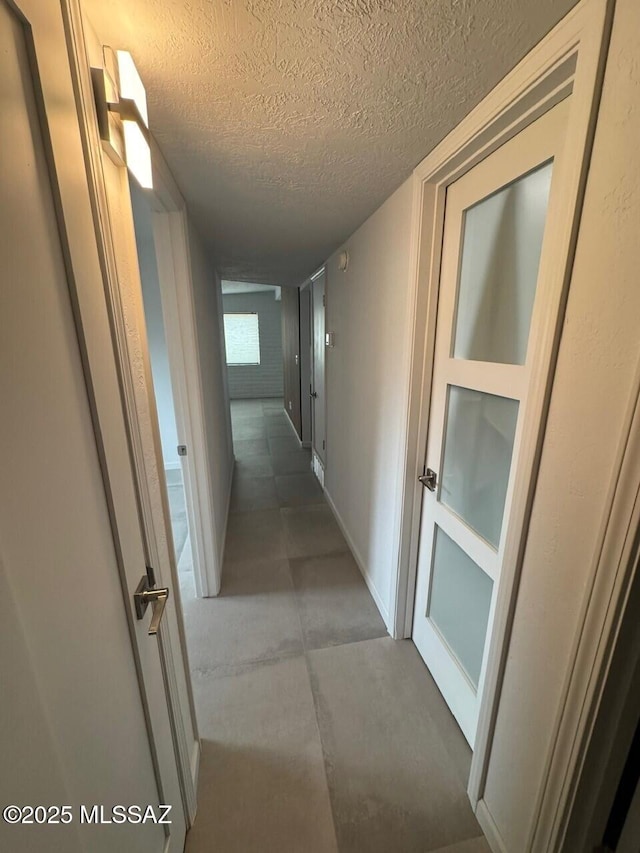 516 E Linden St, Tucson, AZ 85705 - hallway with a textured ceiling and concrete floors