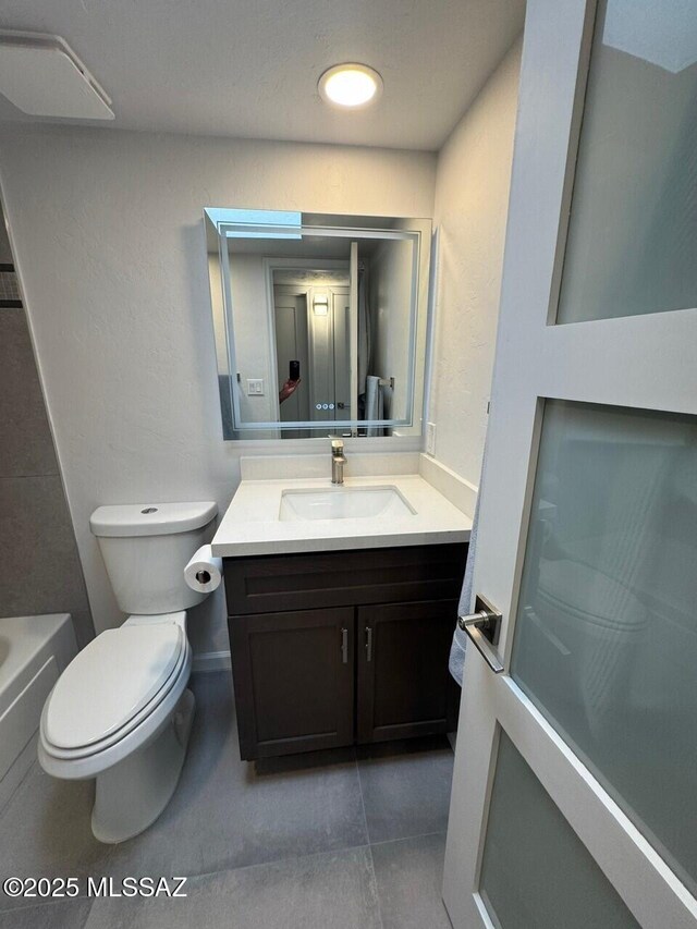 516 E Linden St, Tucson, AZ 85705 - full bathroom featuring vanity, toilet, and tile patterned floors