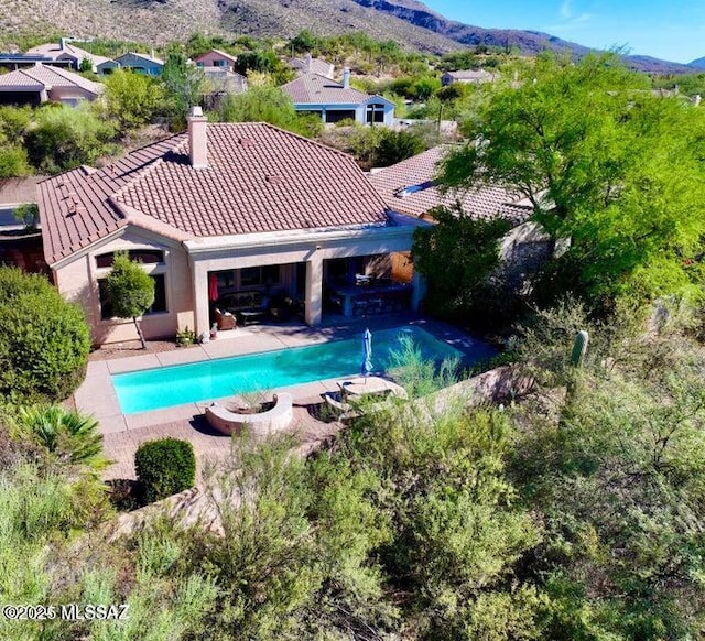 9760 E Spring Ridge Pl N, Tucson, AZ 85749 - outdoor pool with a mountain view and a patio area