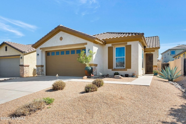 329 W Vuelta Friso, Sahuarita, AZ 85629 - view of front facade with an attached garage, concrete driveway, stucco siding, and a tiled roof