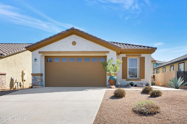 329 W Vuelta Friso, Sahuarita, AZ 85629 - view of front of home with stucco siding, a tiled roof, and concrete driveway