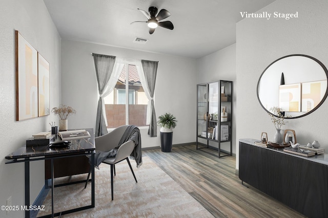329 W Vuelta Friso, Sahuarita, AZ 85629 - office featuring wood finished floors, ceiling fan, and baseboards