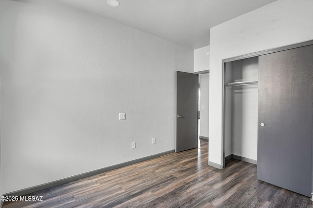 329 W Vuelta Friso, Sahuarita, AZ 85629 - unfurnished bedroom featuring wood finished floors, a closet, and baseboards