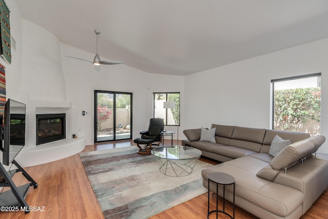 6061 N Tocito Pl, Tucson, AZ 85718 - living area featuring a fireplace, wood finished floors, and a ceiling fan