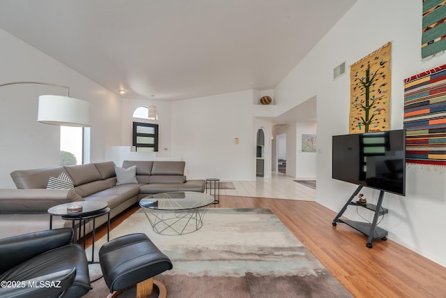 6061 N Tocito Pl, Tucson, AZ 85718 - living area with arched walkways and wood finished floors