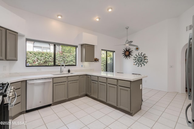 6061 N Tocito Pl, Tucson, AZ 85718 - kitchen featuring stainless steel appliances, a sink, gray cabinets, a peninsula, and light countertops