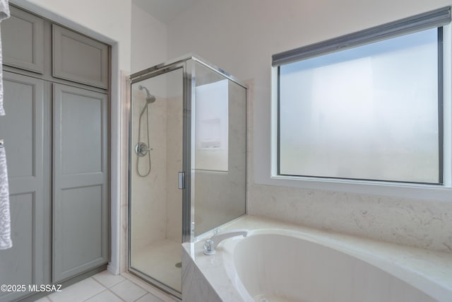 6061 N Tocito Pl, Tucson, AZ 85718 - full bathroom featuring a bath, a shower stall, and tile patterned floors