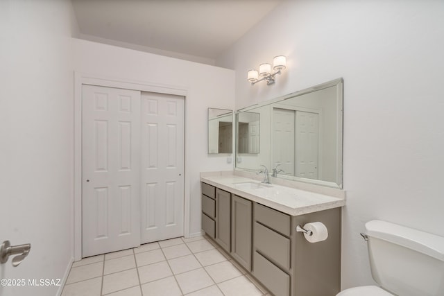 6061 N Tocito Pl, Tucson, AZ 85718 - bathroom with vanity, tile patterned flooring, toilet, and baseboards