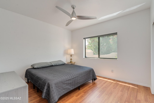 6061 N Tocito Pl, Tucson, AZ 85718 - bedroom with light wood finished floors, baseboards, and ceiling fan