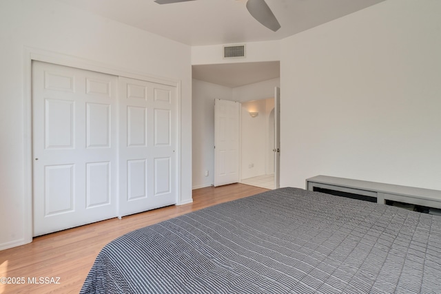 6061 N Tocito Pl, Tucson, AZ 85718 - bedroom featuring wood finished floors, a ceiling fan, and baseboards