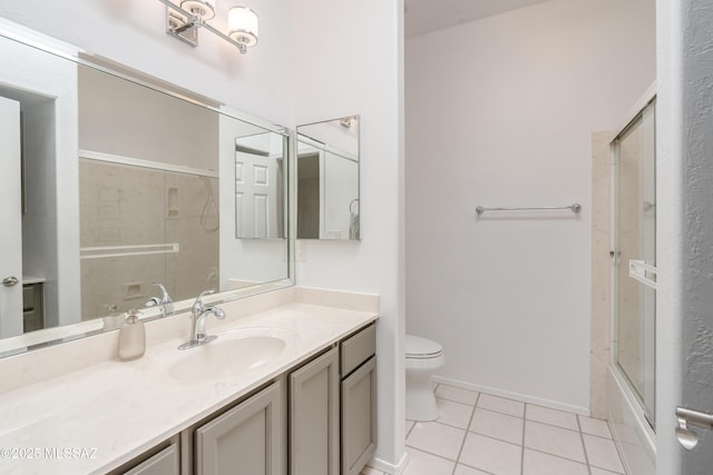 6061 N Tocito Pl, Tucson, AZ 85718 - bathroom featuring tile patterned flooring, toilet, vanity, and shower / bath combination with glass door