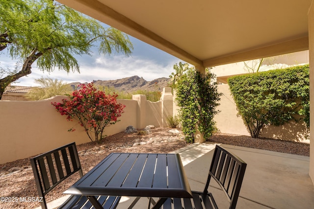 6061 N Tocito Pl, Tucson, AZ 85718 - fenced backyard featuring a patio area and a mountain view