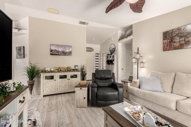 5831 N Moonbrook Rd, Tucson, AZ 85741 - living room with ceiling fan and light wood-style floors