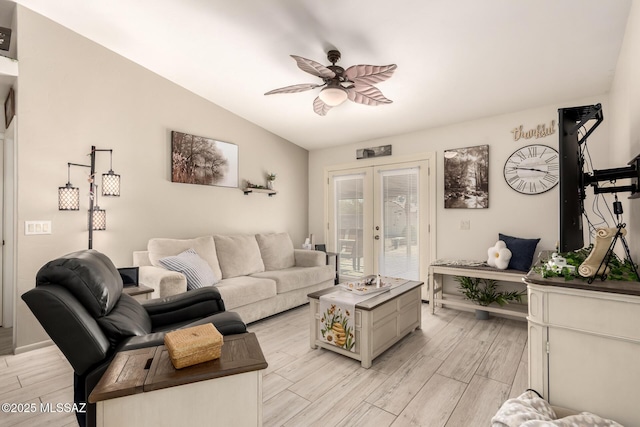 5831 N Moonbrook Rd, Tucson, AZ 85741 - living area with light wood-style flooring, a ceiling fan, lofted ceiling, and baseboards