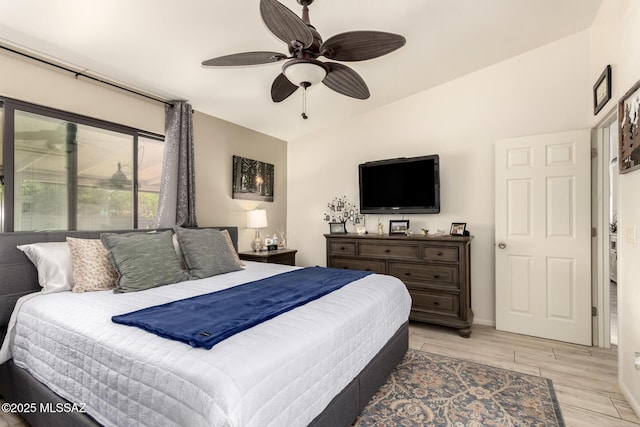5831 N Moonbrook Rd, Tucson, AZ 85741 - bedroom with light wood-style flooring, ceiling fan, and baseboards
