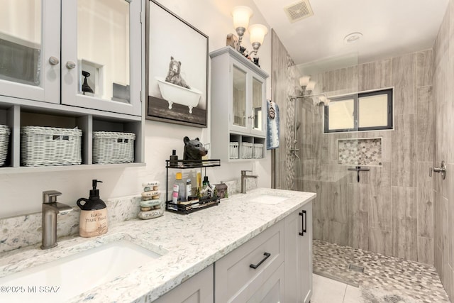 5831 N Moonbrook Rd, Tucson, AZ 85741 - full bathroom featuring tiled shower and double vanity