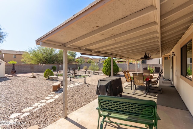 5831 N Moonbrook Rd, Tucson, AZ 85741 - fenced backyard with a patio area and outdoor dining area