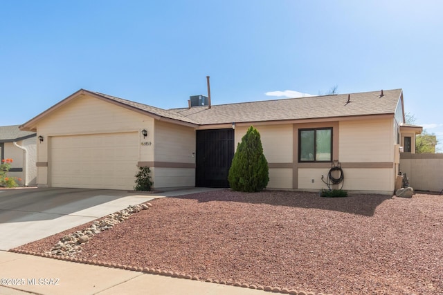 5831 N Moonbrook Rd, Tucson, AZ 85741 - ranch-style home featuring an attached garage, concrete driveway, and roof with shingles