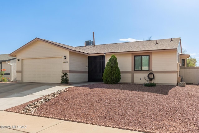 5831 N Moonbrook Rd, Tucson, AZ 85741 - single story home featuring an attached garage, driveway, and a shingled roof
