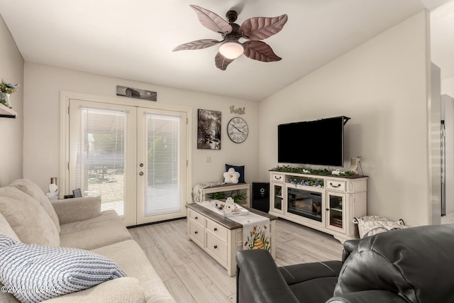 5831 N Moonbrook Rd, Tucson, AZ 85741 - living area featuring french doors, vaulted ceiling, a ceiling fan, and light wood finished floors