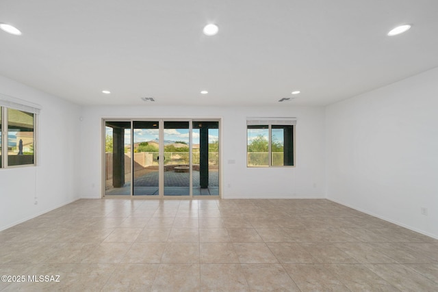 11324 Granite Gulch Way, Tucson, AZ 85747 - empty room with recessed lighting, light tile patterned floors, and baseboards