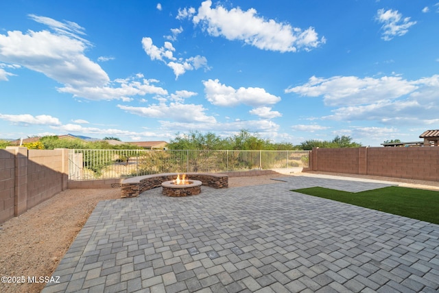 11324 Granite Gulch Way, Tucson, AZ 85747 - fenced backyard featuring an outdoor fire pit and a patio area