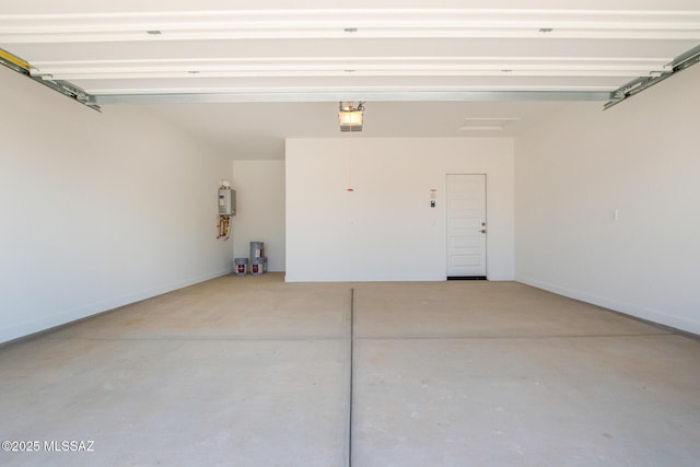 9810 E Gray Hawk Dr, Tucson, AZ 85730 - garage featuring a garage door opener, water heater, and baseboards
