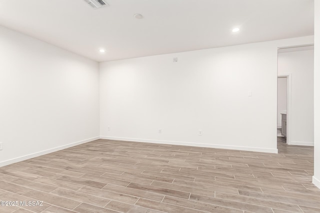 9810 E Gray Hawk Dr, Tucson, AZ 85730 - spare room with light wood-style flooring, baseboards, and recessed lighting