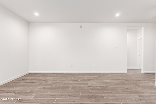 9810 E Gray Hawk Dr, Tucson, AZ 85730 - unfurnished room with light wood-style flooring, recessed lighting, and baseboards