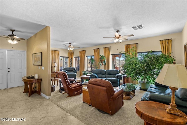 1969 W Three Oclock Hill Rd, Oracle, AZ 85623 - living area featuring ceiling fan, light tile patterned flooring, and a textured ceiling