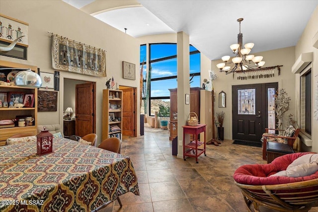 1969 W Three Oclock Hill Rd, Oracle, AZ 85623 - dining room featuring a towering ceiling, a chandelier, and arched walkways