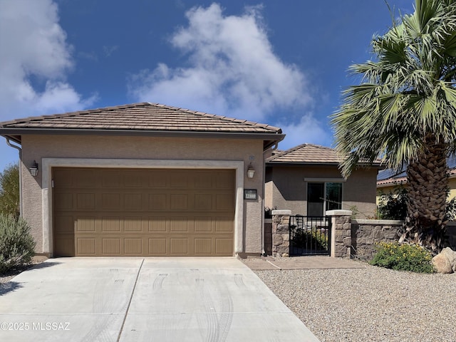 22100 E Statehood Ln, Red Rock, AZ 85145 - view of front facade with driveway, stucco siding, a garage, and a gate