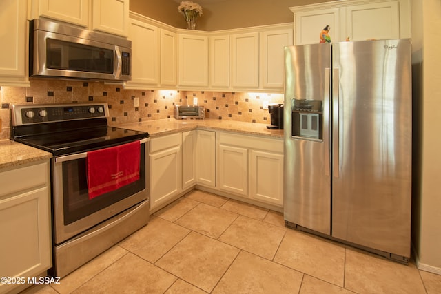 22100 E Statehood Ln, Red Rock, AZ 85145 - kitchen with appliances with stainless steel finishes, tasteful backsplash, and light tile patterned floors