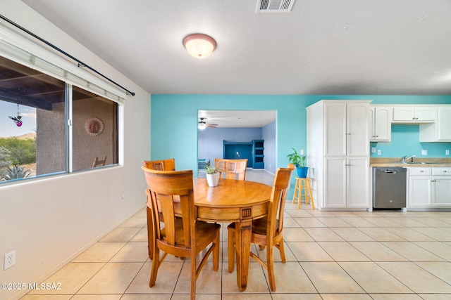 1448 N Calle Futura, Oracle, AZ 85623 - dining room featuring light tile patterned floors, ceiling fan, and baseboards