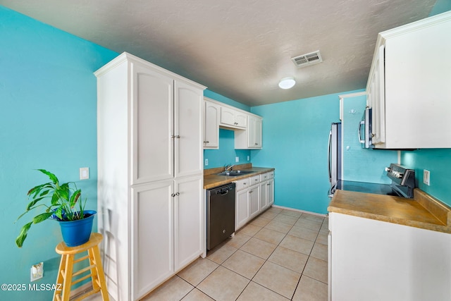 1448 N Calle Futura, Oracle, AZ 85623 - kitchen featuring appliances with stainless steel finishes, a sink, white cabinets, and light tile patterned floors