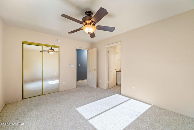 1448 N Calle Futura, Oracle, AZ 85623 - unfurnished bedroom with light colored carpet, a closet, baseboards, and ensuite bathroom