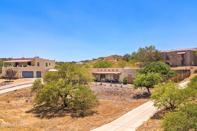1448 N Calle Futura, Oracle, AZ 85623 - view of property's community featuring a garage