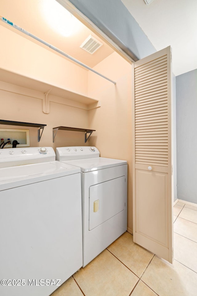 1448 N Calle Futura, Oracle, AZ 85623 - laundry room featuring separate washer and dryer and light tile patterned floors