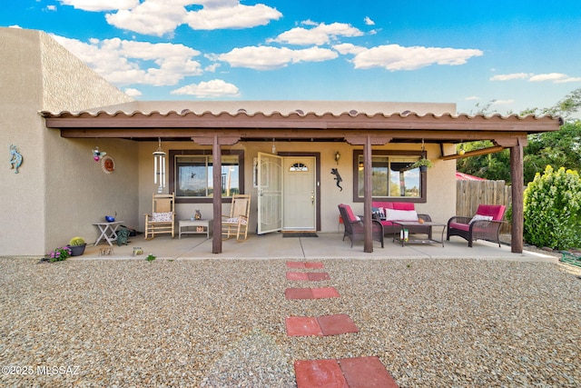 1448 N Calle Futura, Oracle, AZ 85623 - back of property with an outdoor living space, stucco siding, and a patio