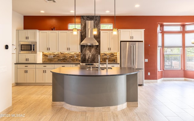 13570 N Nightstar Ct, Marana, AZ 85658 - kitchen featuring stainless steel appliances, island range hood, a sink, dark countertops, and an island with sink