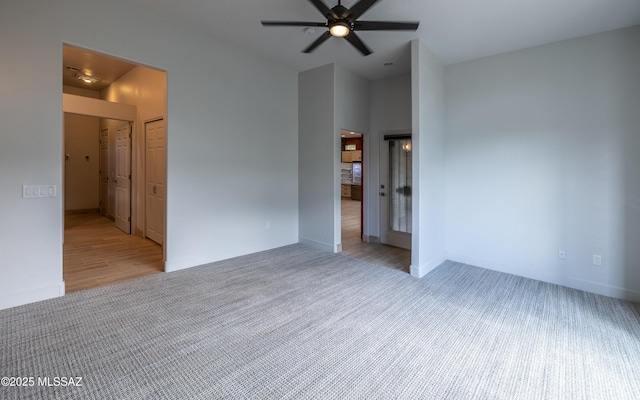 13570 N Nightstar Ct, Marana, AZ 85658 - empty room with carpet floors, ceiling fan, and baseboards