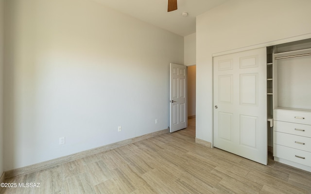 13570 N Nightstar Ct, Marana, AZ 85658 - unfurnished bedroom featuring light wood finished floors, a closet, baseboards, and ceiling fan