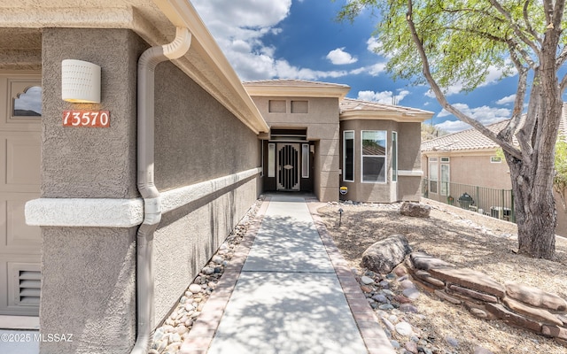 13570 N Nightstar Ct, Marana, AZ 85658 - doorway to property featuring stucco siding