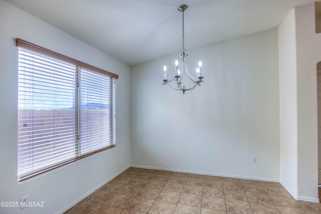 7077 S Cottontail Run Ave, Tucson, AZ 85756 - spare room featuring a chandelier and baseboards