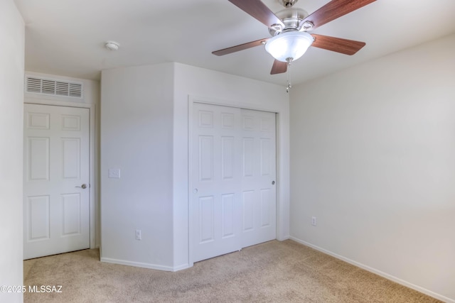 7077 S Cottontail Run Ave, Tucson, AZ 85756 - unfurnished bedroom featuring carpet flooring, baseboards, a closet, and a ceiling fan